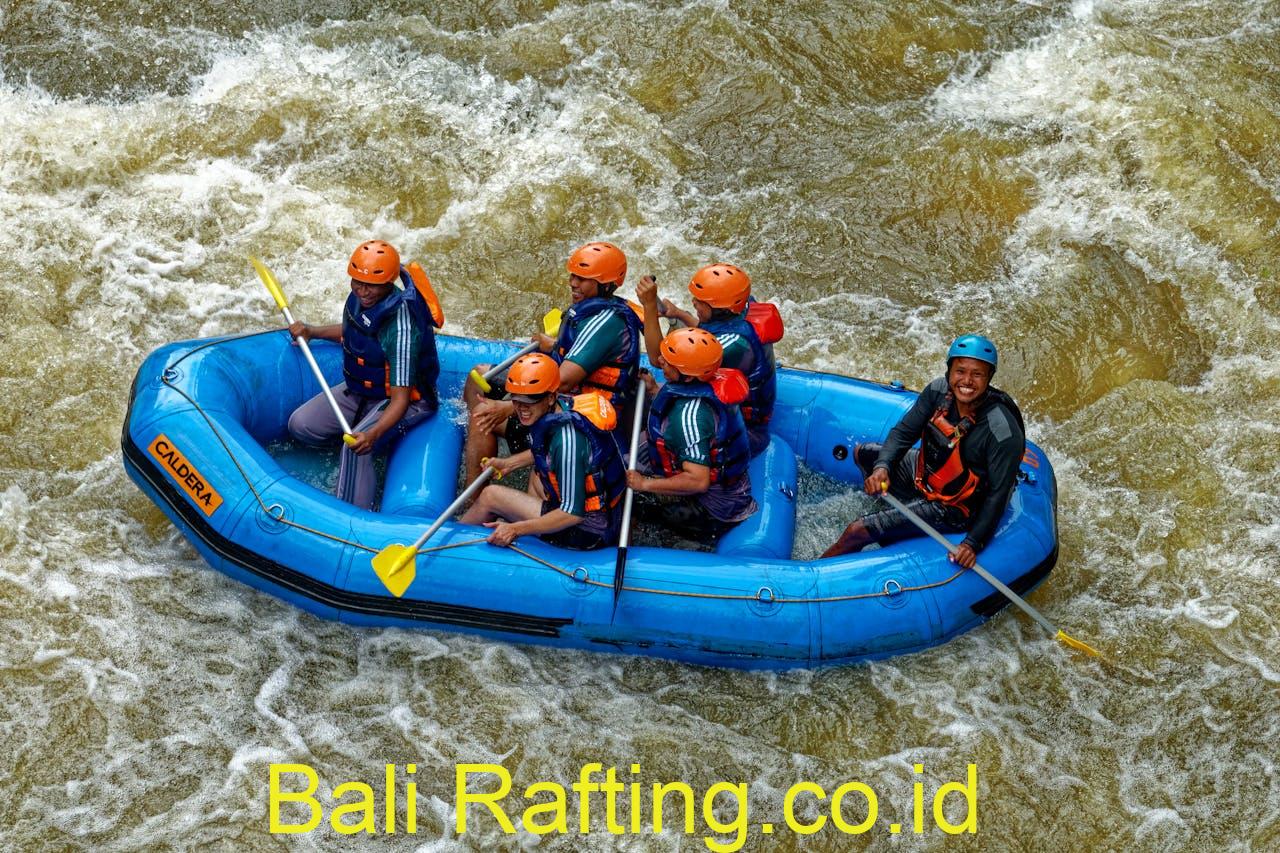 Group Of People Riding Blue Raft On Body Of Water